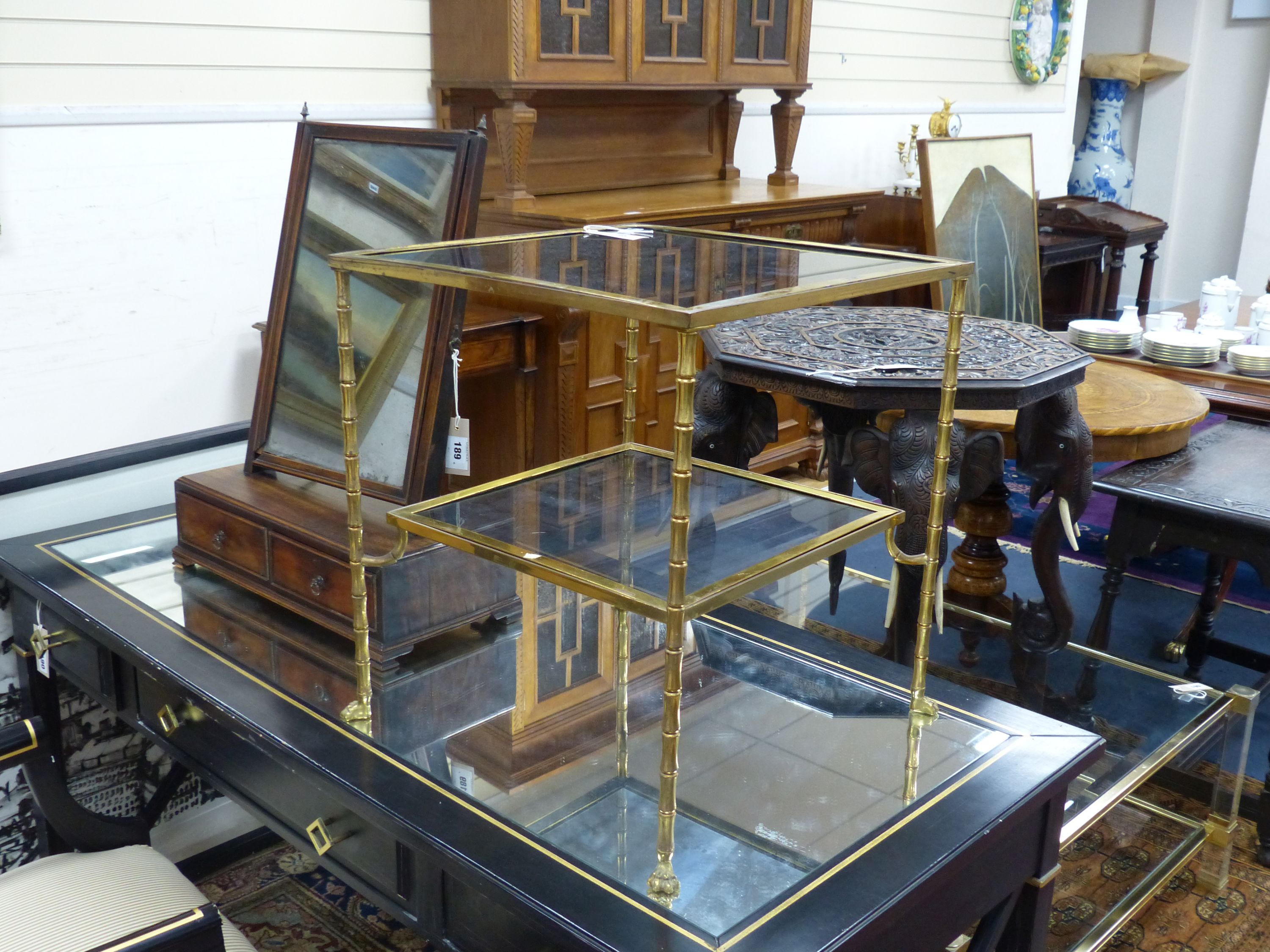 A Maison Jansen style simulated bamboo brass two tier brass table, width 46cm, depth 46cm, height 50cm